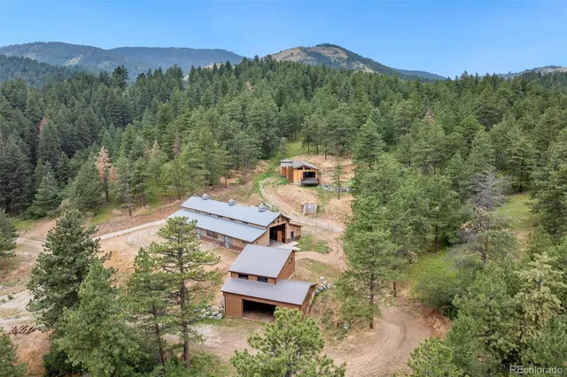 an aerial view of a house with mountain view
