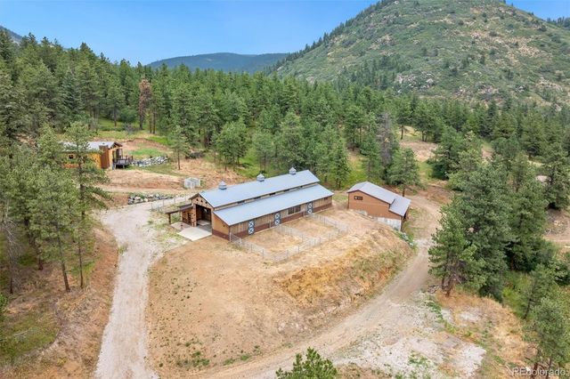 a view of a terrace with a garden and trees