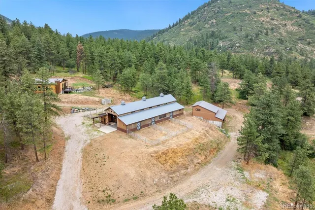 a view of a terrace with a garden and trees