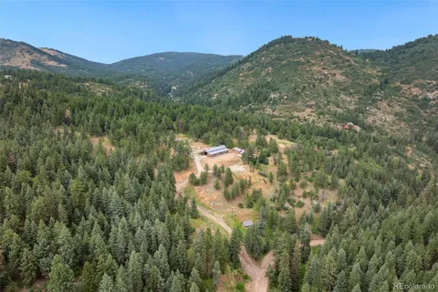 a view of a mountain in the distance in a field