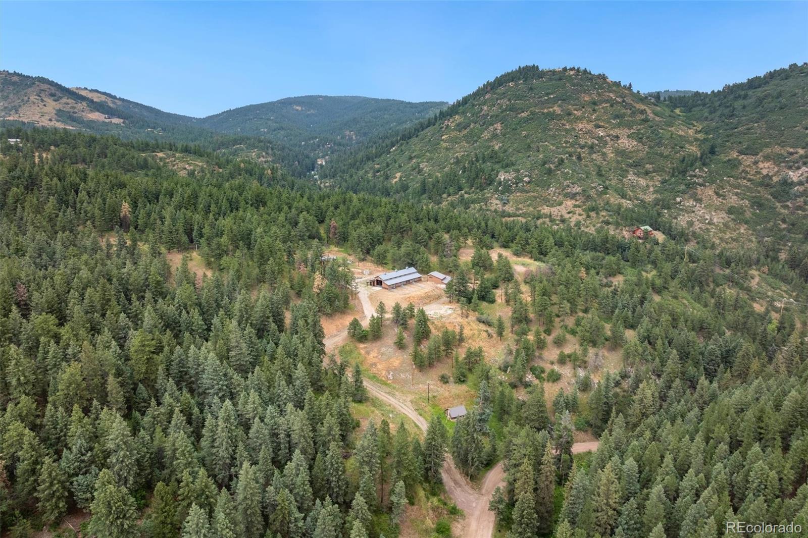 10013 McKinney Road Littleton, CO 80127 - Photo 44 of 50 a view of a mountain in the distance in a field