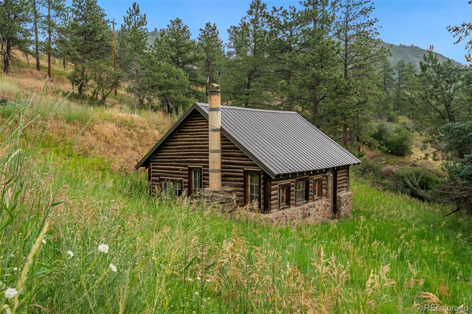 10013 McKinney Road Littleton, CO 80127 - Photo 49 of 50 a view of a house with pool and trees all around