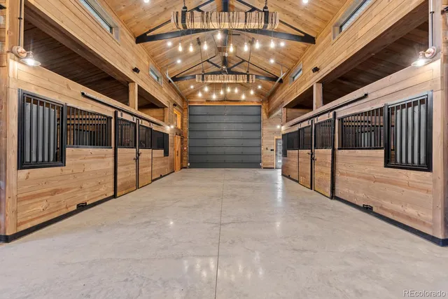 a view of an empty room with a ceiling fan