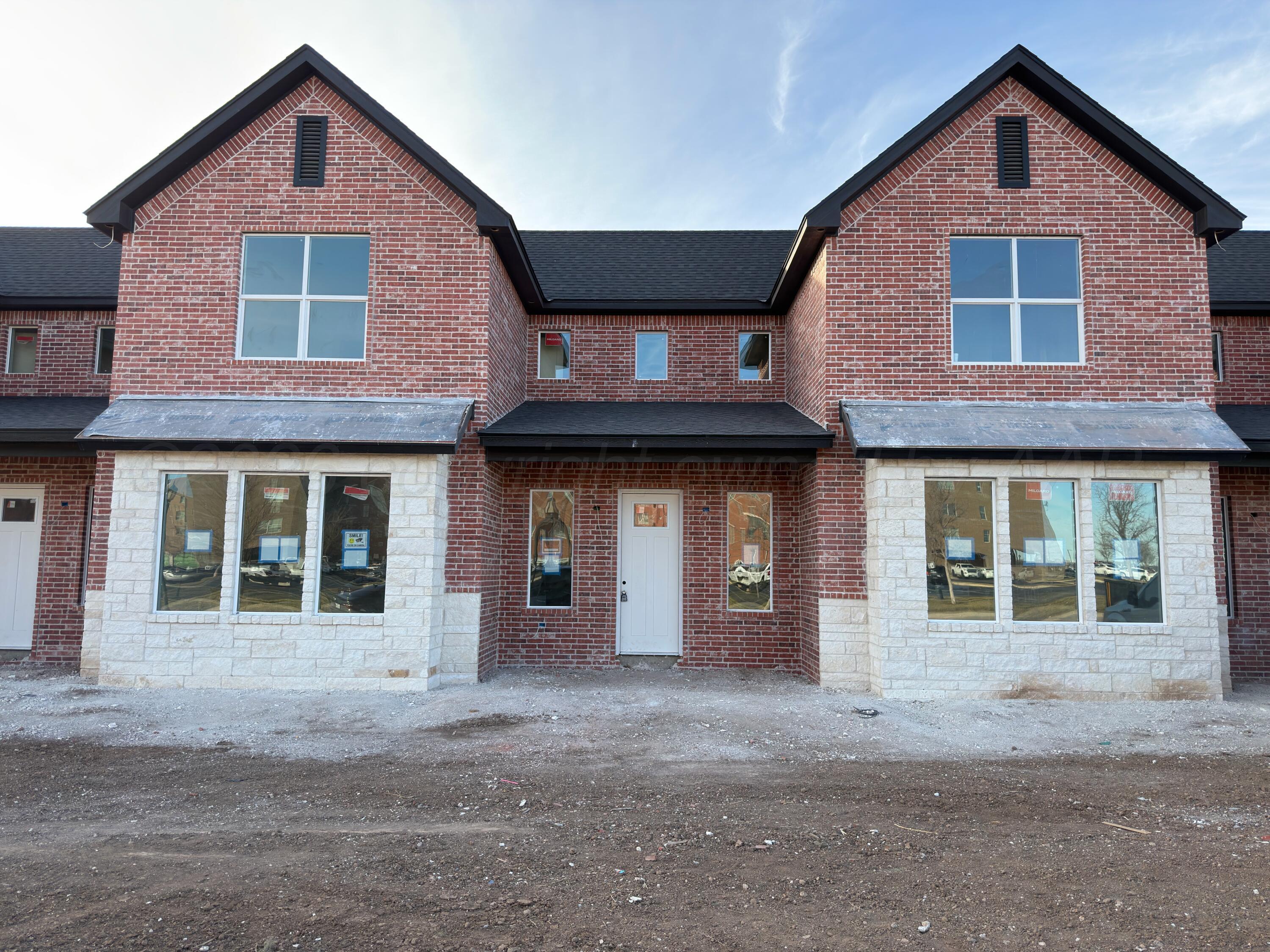 a front view of a house with a garage