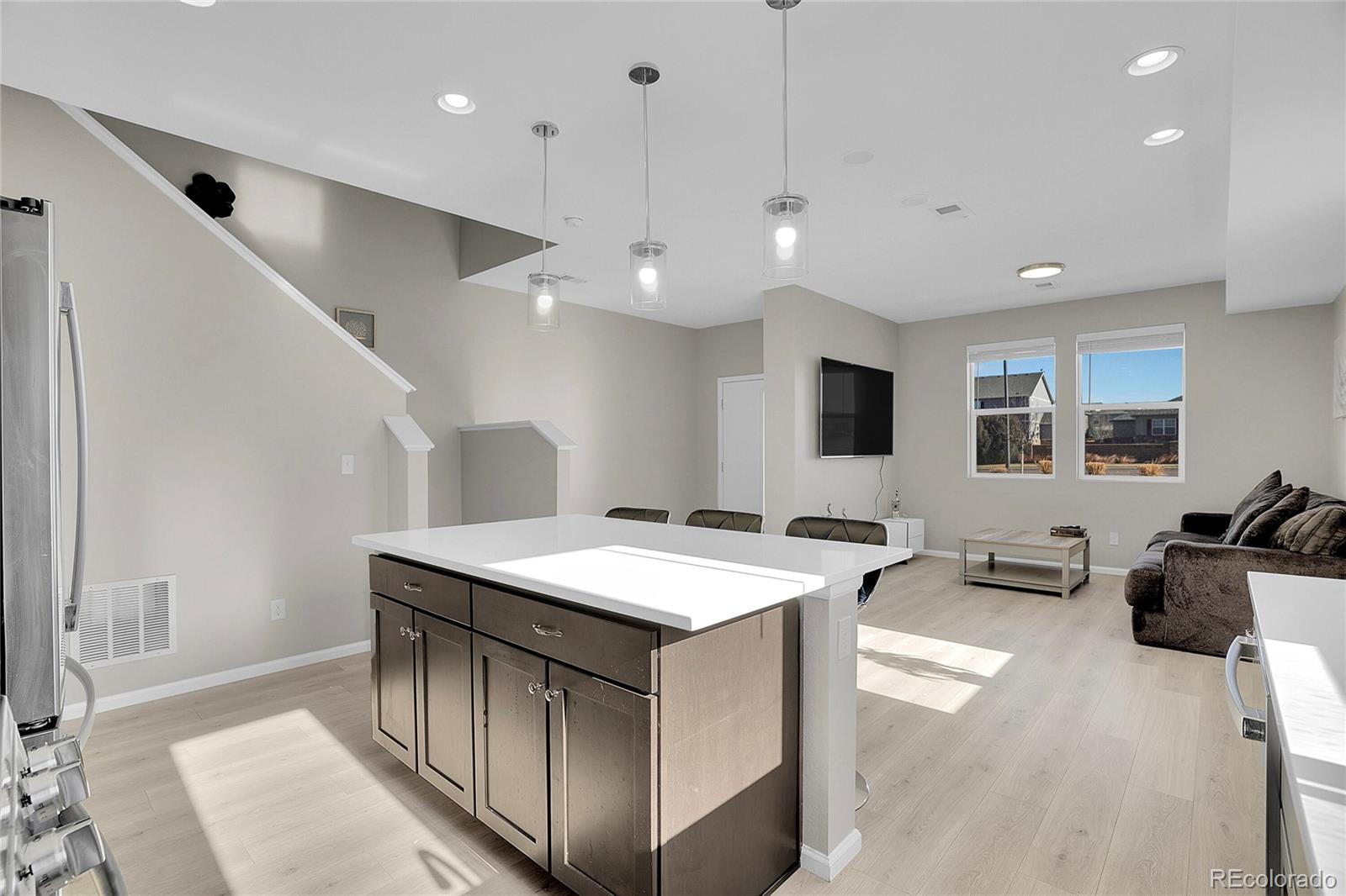 6419 North Dunkirk Street Denver, CO 80249 - Photo 14 of 31 a open kitchen with stainless steel appliances granite countertop a stove and a sink
