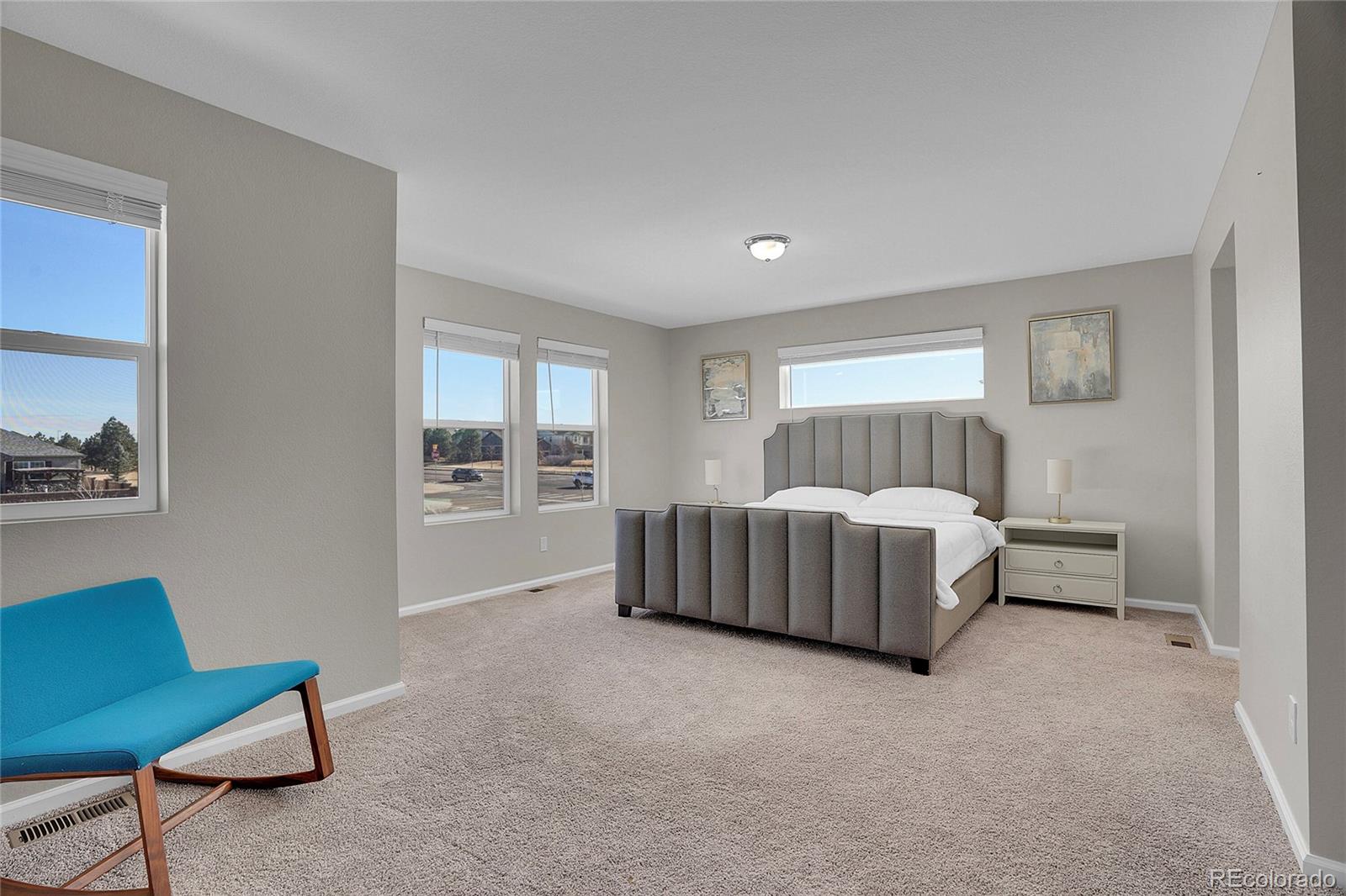 6419 North Dunkirk Street Denver, CO 80249 - Photo 21 of 31 a bed room with a bed and a couch