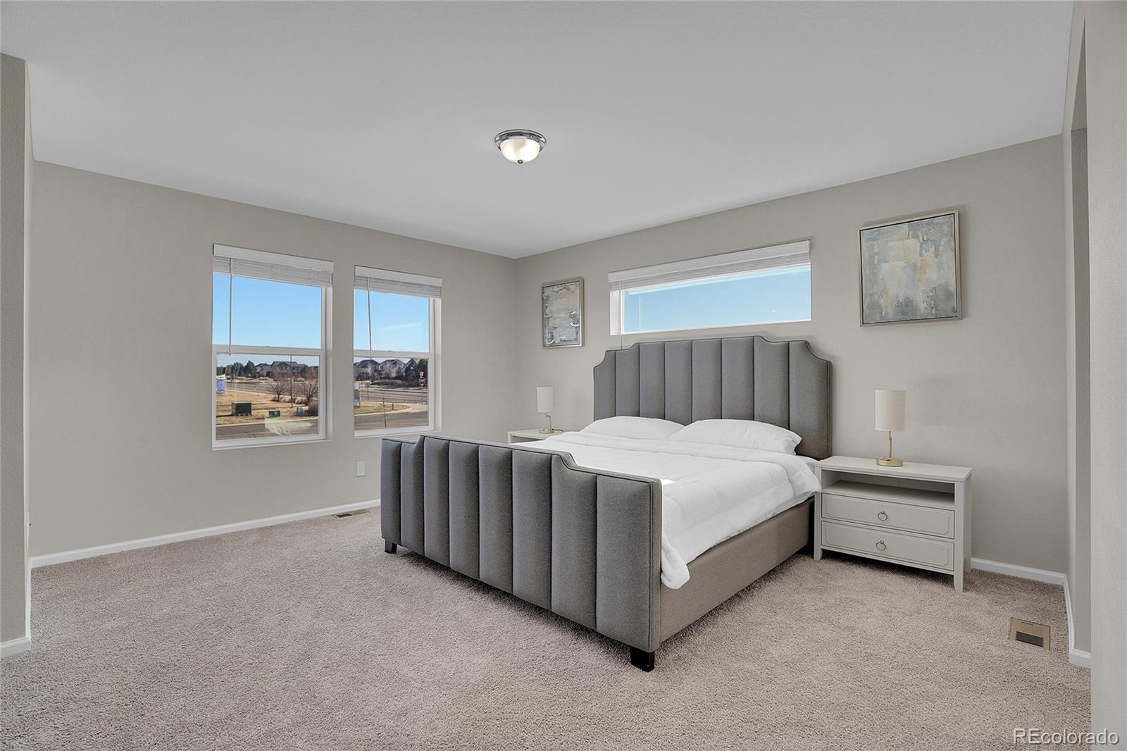 6419 North Dunkirk Street Denver, CO 80249 - Photo 22 of 31 a bed room with a bed and a window