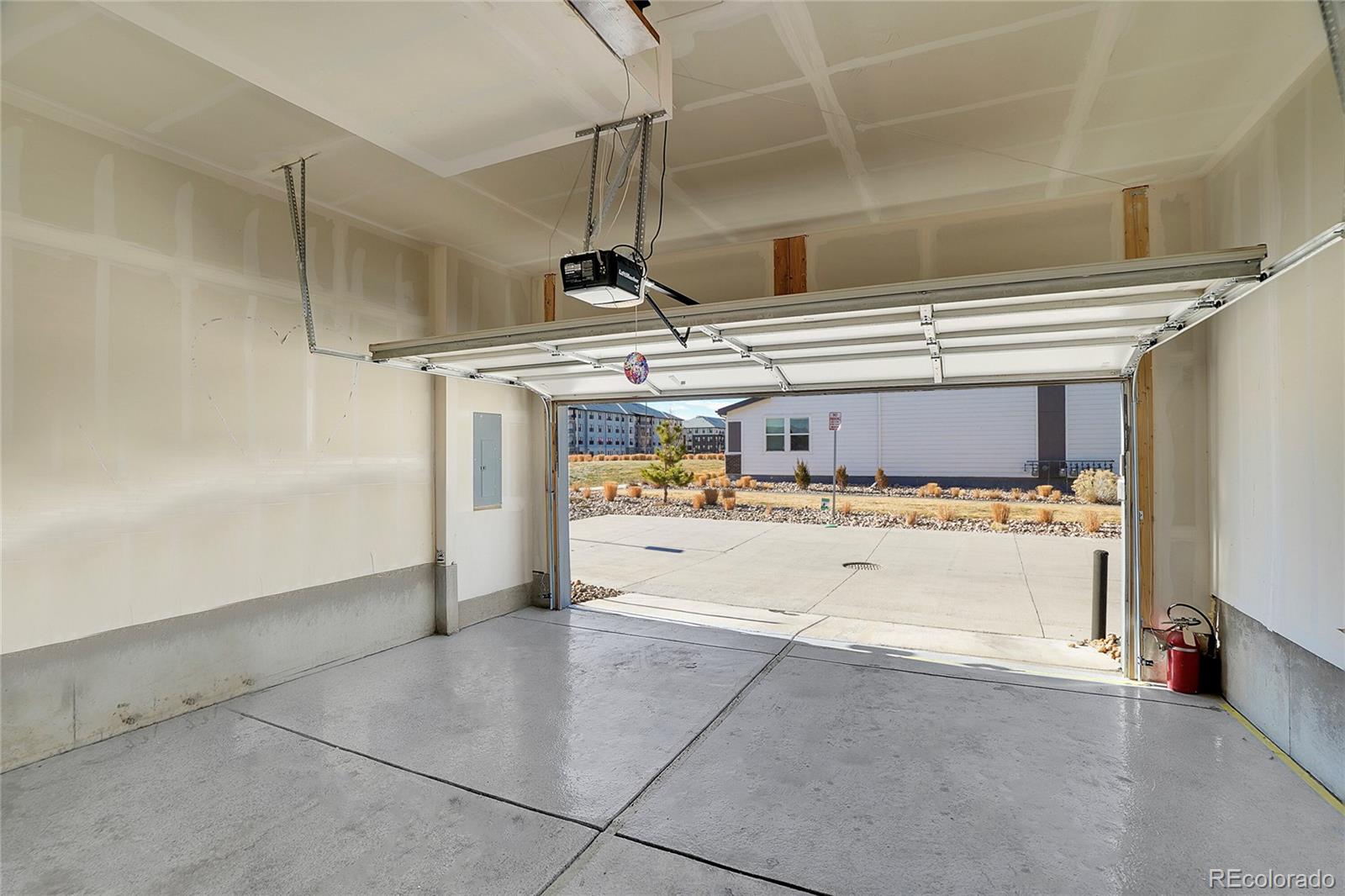 6419 North Dunkirk Street Denver, CO 80249 - Photo 29 of 31 a bathroom with a tub sink and mirror