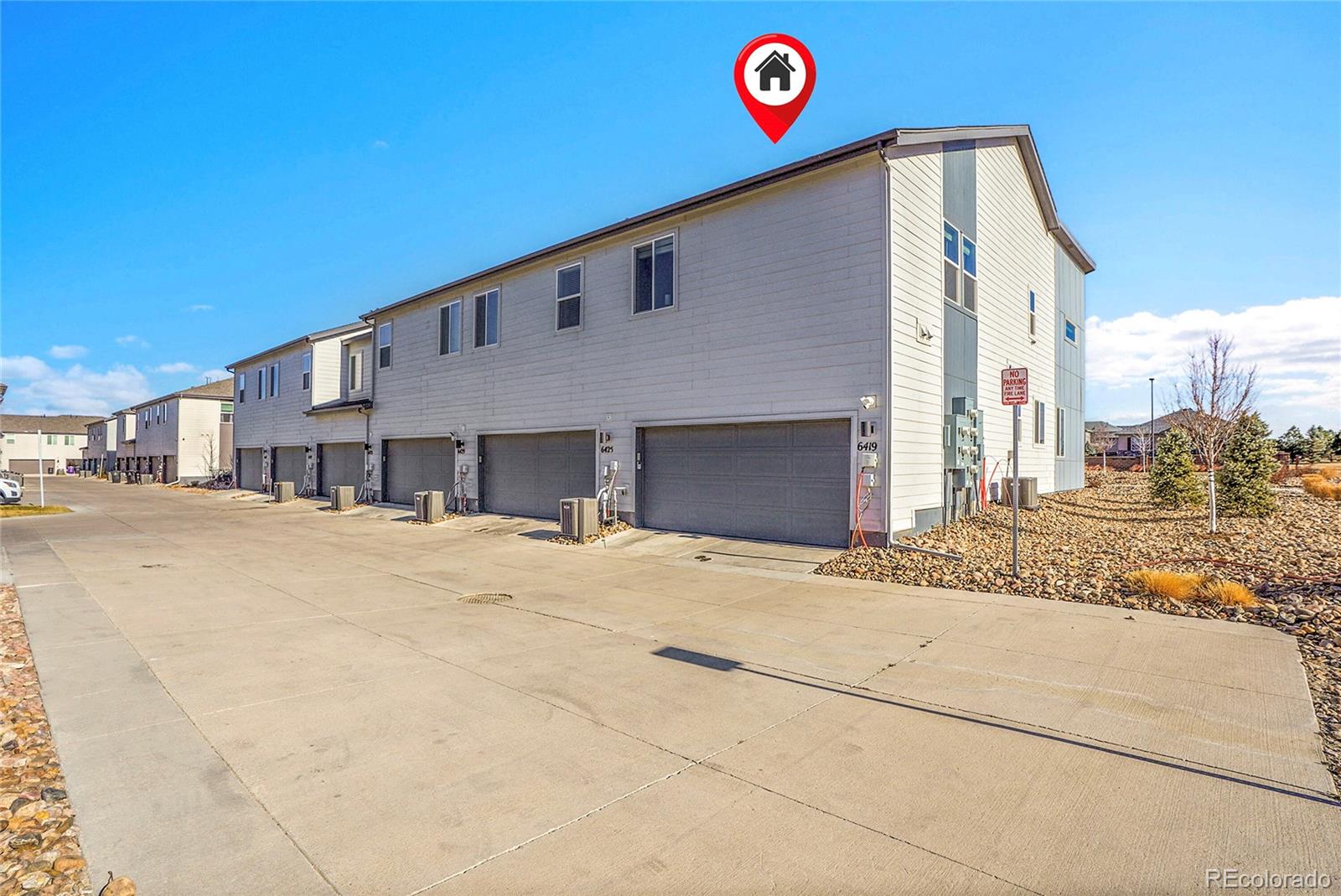 6419 North Dunkirk Street Denver, CO 80249 - Photo 31 of 31 a view of a house with a snow on the road