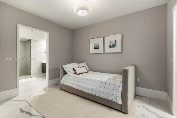 a bedroom with a bed and chair