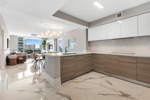 a kitchen with cabinets and window