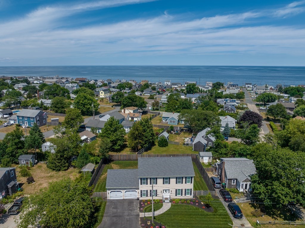 an aerial view of a house with a yard