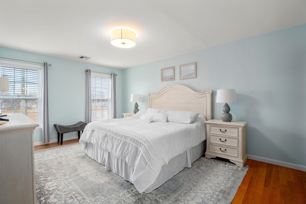 106 Colonial Road Marshfield, MA 02050 - Photo 15 of 42 a bedroom with a bed and a couch