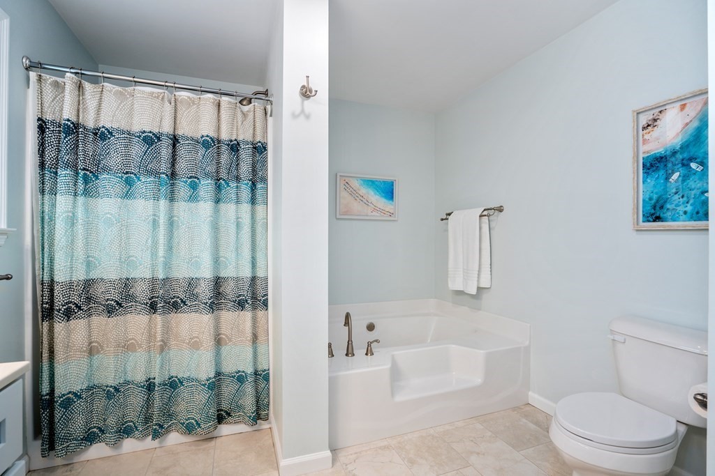 106 Colonial Road Marshfield, MA 02050 - Photo 18 of 42 a bathroom with a bathtub and a shower