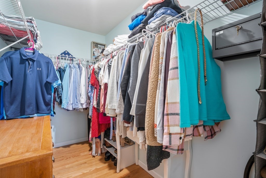 106 Colonial Road Marshfield, MA 02050 - Photo 19 of 42 a view of walk in closet with clothes