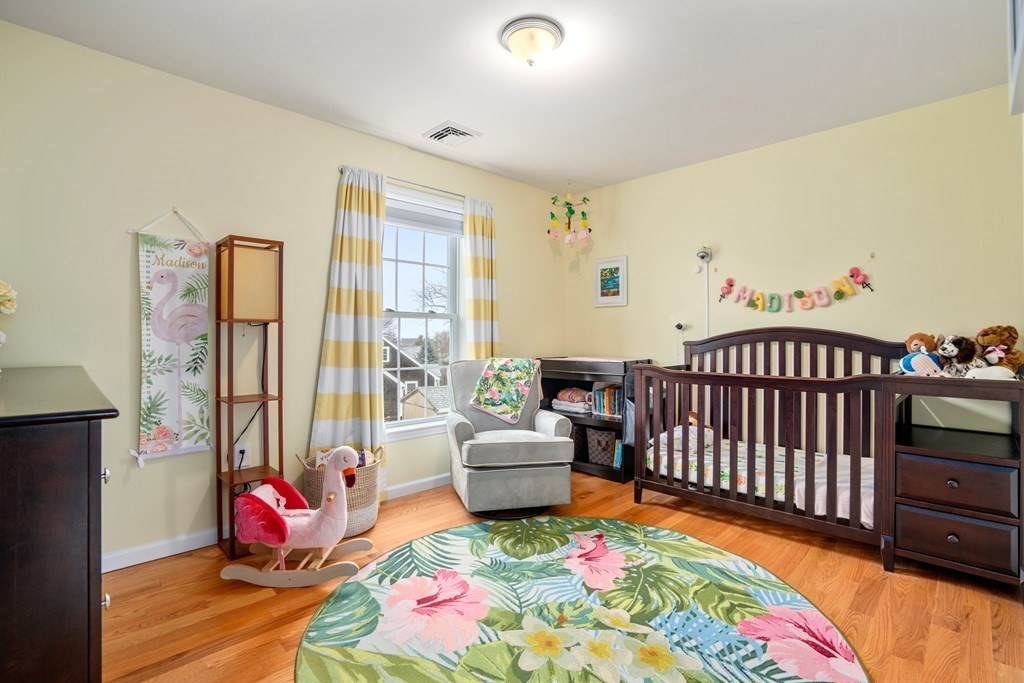 106 Colonial Road Marshfield, MA 02050 - Photo 22 of 42 a bedroom with a bed and a window