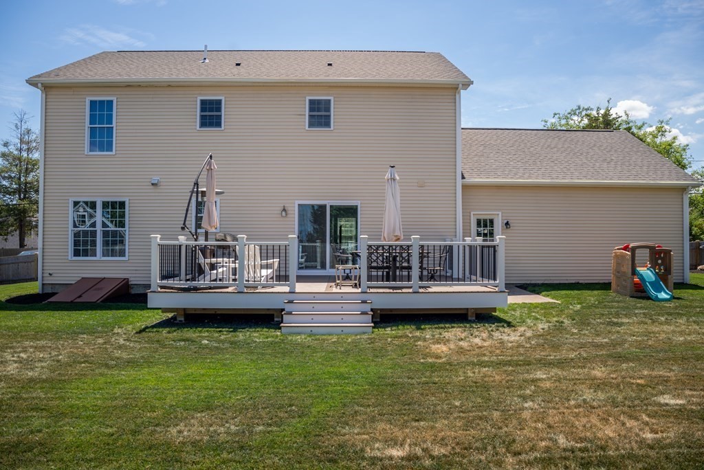106 Colonial Road Marshfield, MA 02050 - Photo 28 of 42 a view of a house with a yard and sitting area