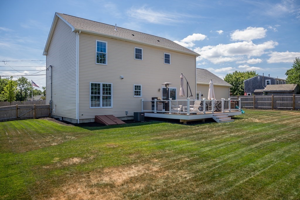 106 Colonial Road Marshfield, MA 02050 - Photo 30 of 42 a view of a house with a yard