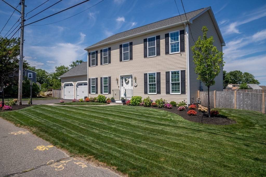 106 Colonial Road Marshfield, MA 02050 - Photo 37 of 42 a front view of a house with a yard
