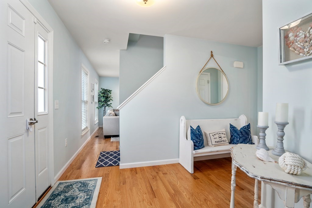 106 Colonial Road Marshfield, MA 02050 - Photo 6 of 42 a living room with furniture and a rug