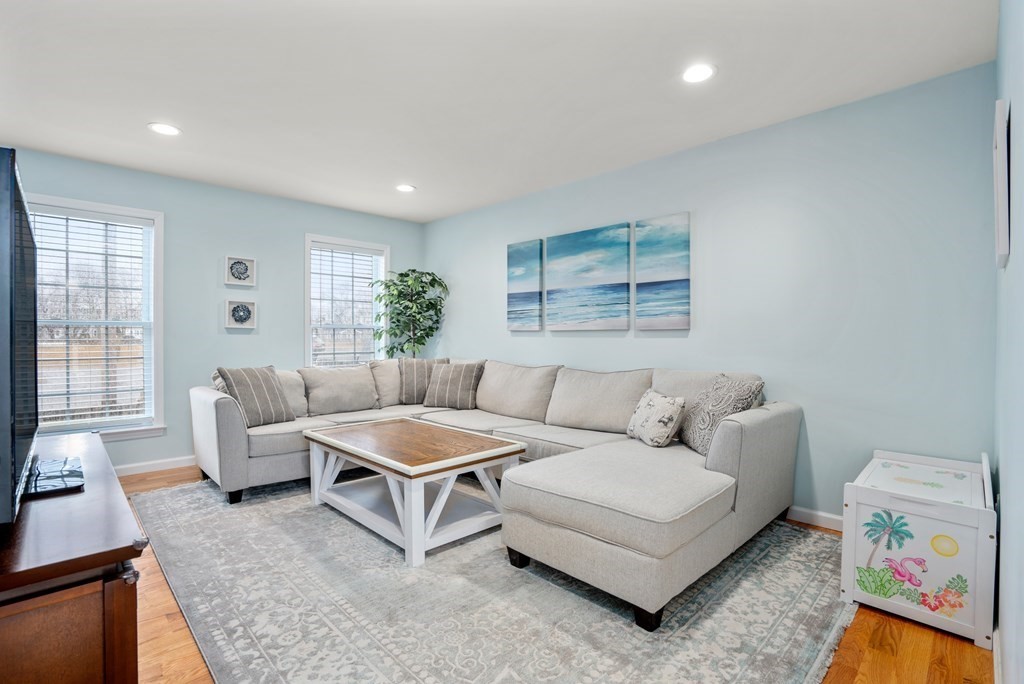 106 Colonial Road Marshfield, MA 02050 - Photo 7 of 42 a living room with furniture and a large window