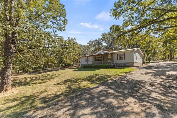 a house with trees in front of it