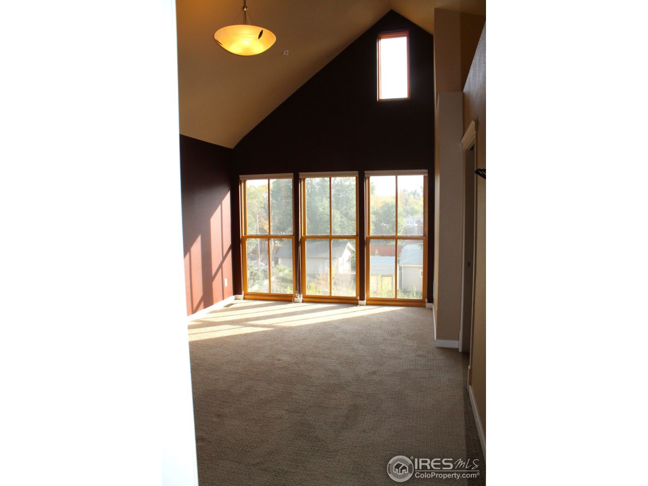 325 Cherry Street, Unit 210 Fort Collins, CO 80521 - Photo 11 of 13 a view of an empty room with a window