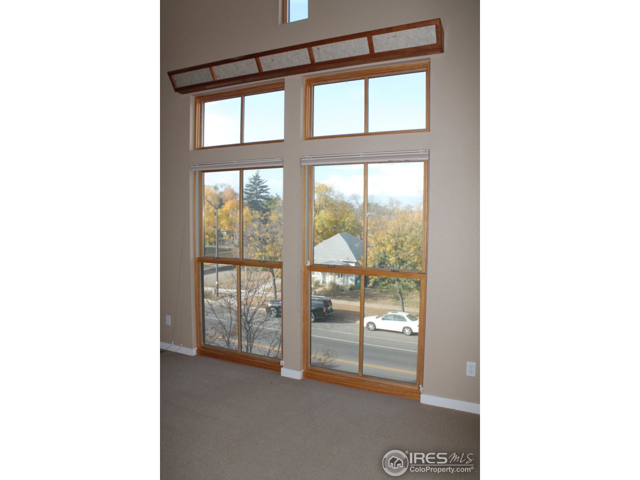 325 Cherry Street, Unit 210 Fort Collins, CO 80521 - Photo 12 of 13 a view of an empty room with a window