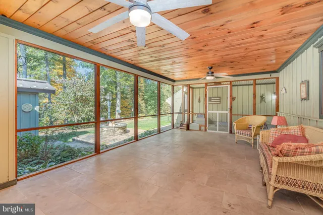 a view of entryway and hall with a bathtub