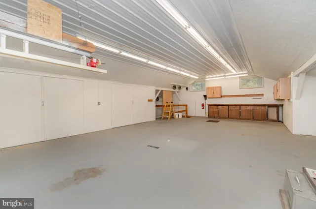 a view of a house with a yard and garage