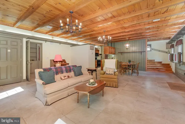 a view of a livingroom with furniture and a flat screen tv