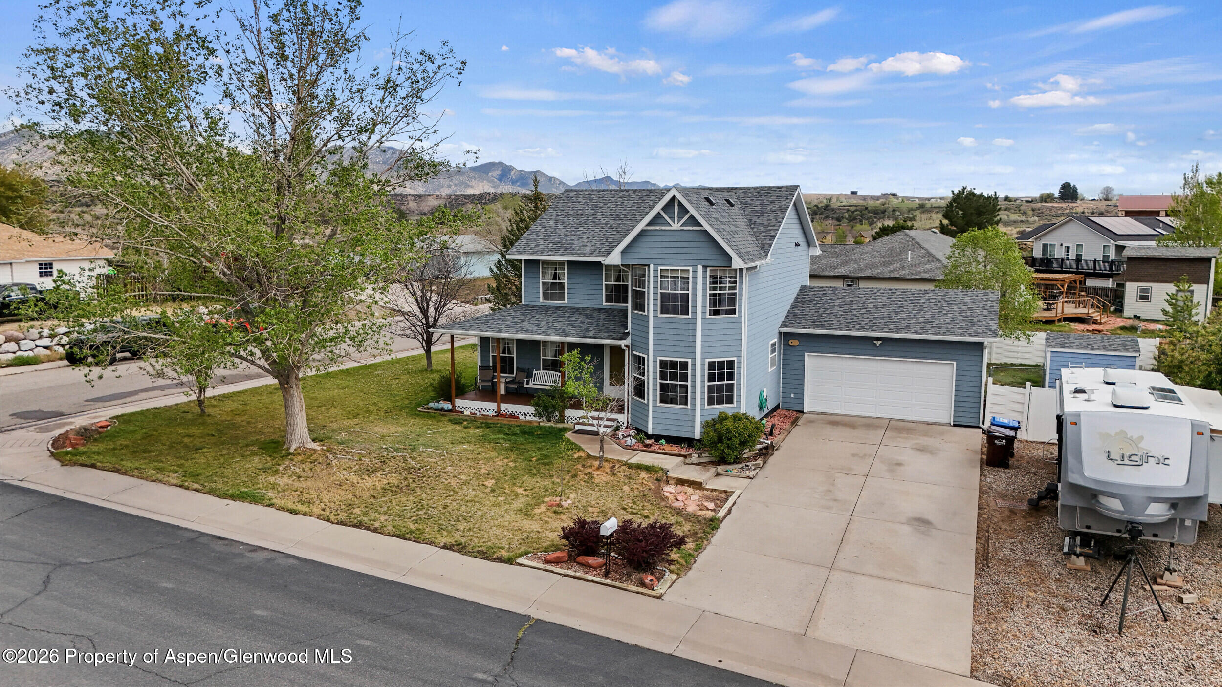 2750 East Avenue Rifle, CO 81650 - Photo 1 of 35 a front view of a house with garden