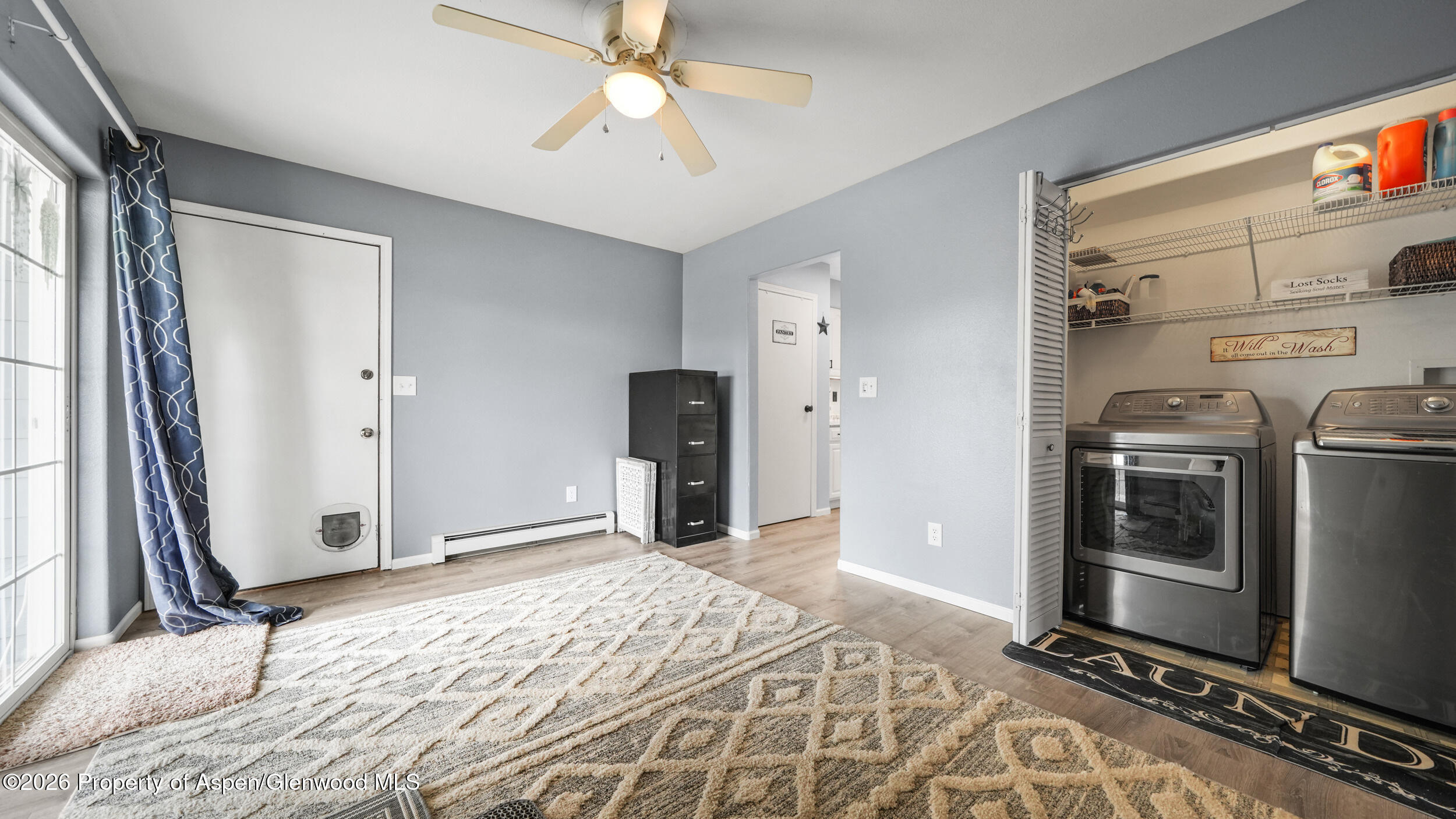 2750 East Avenue Rifle, CO 81650 - Photo 14 of 35 a bedroom with a bed dresser and a window