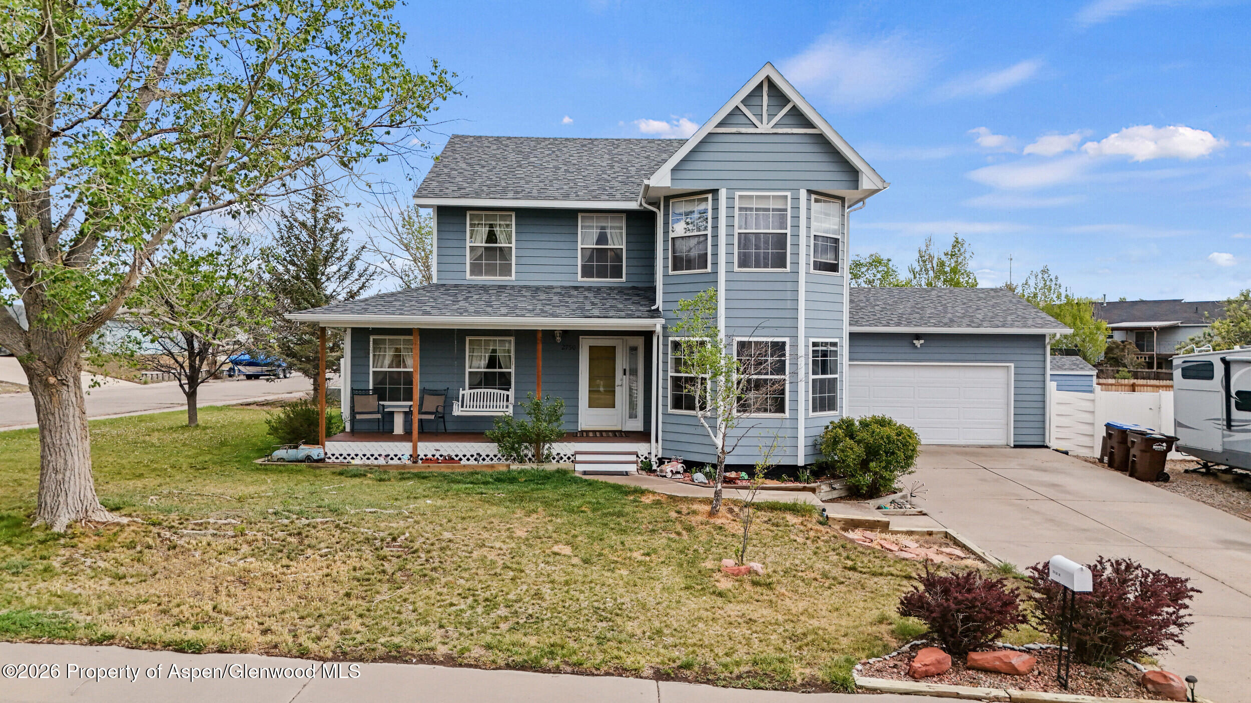 2750 East Avenue Rifle, CO 81650 - Photo 2 of 35 front view of a house with a yard