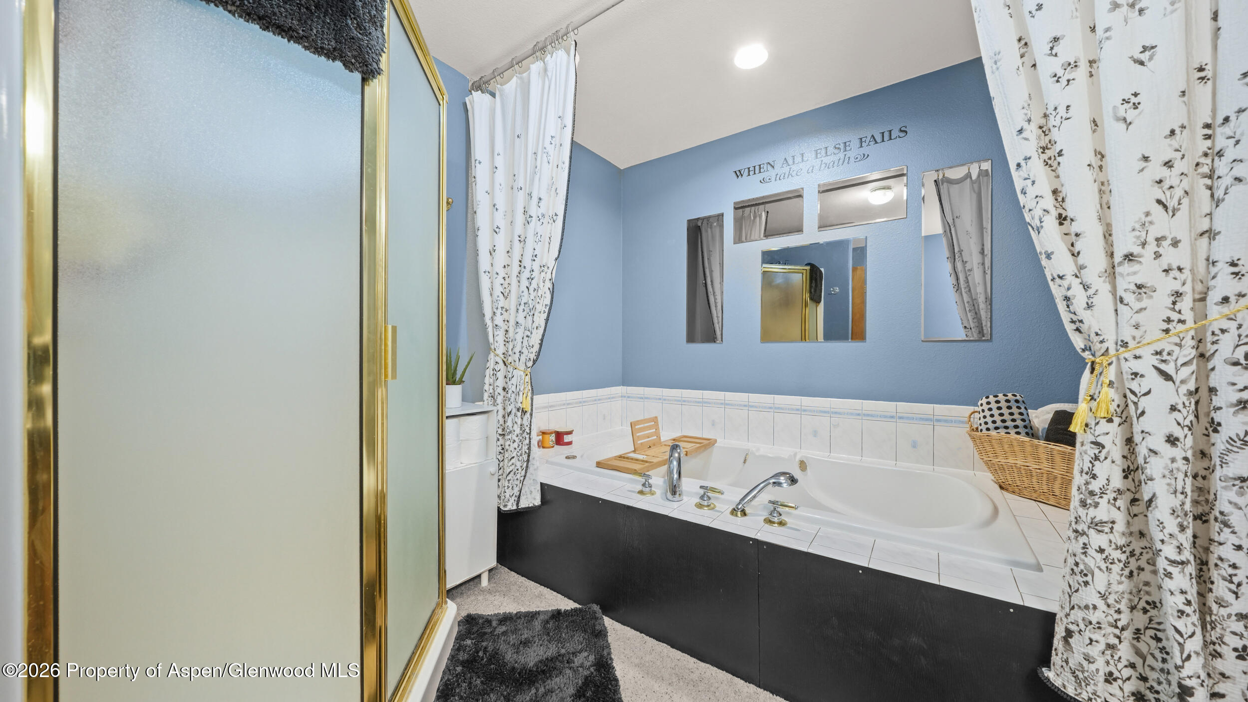 2750 East Avenue Rifle, CO 81650 - Photo 23 of 35 a bathroom with a bathtub and a sink