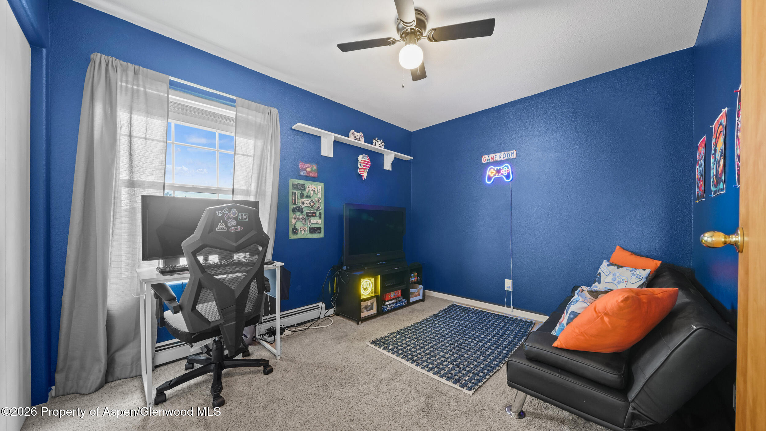2750 East Avenue Rifle, CO 81650 - Photo 26 of 35 a room with furniture and gym equipment