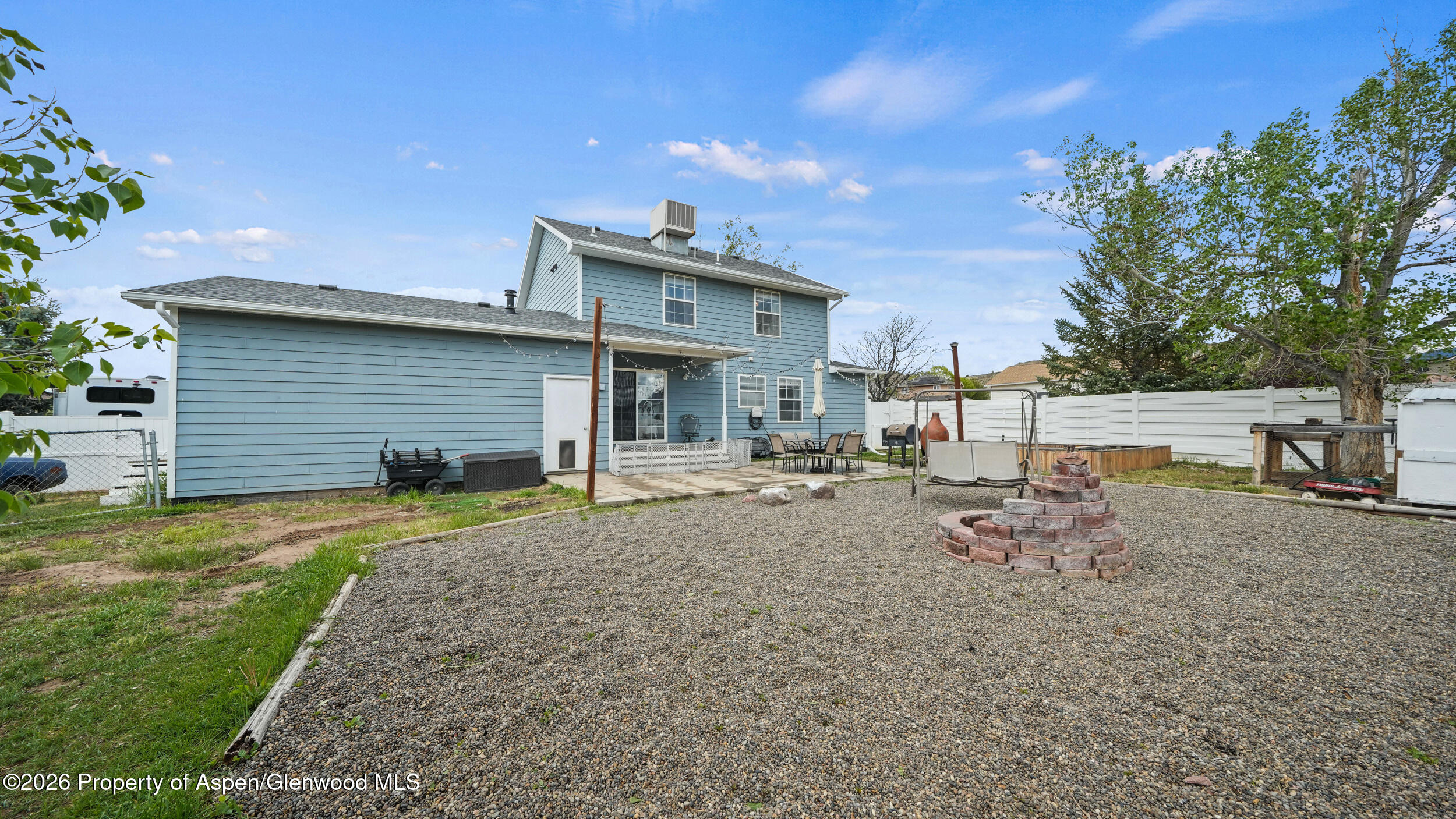 2750 East Avenue Rifle, CO 81650 - Photo 29 of 35 a backyard of a house with table and chairs