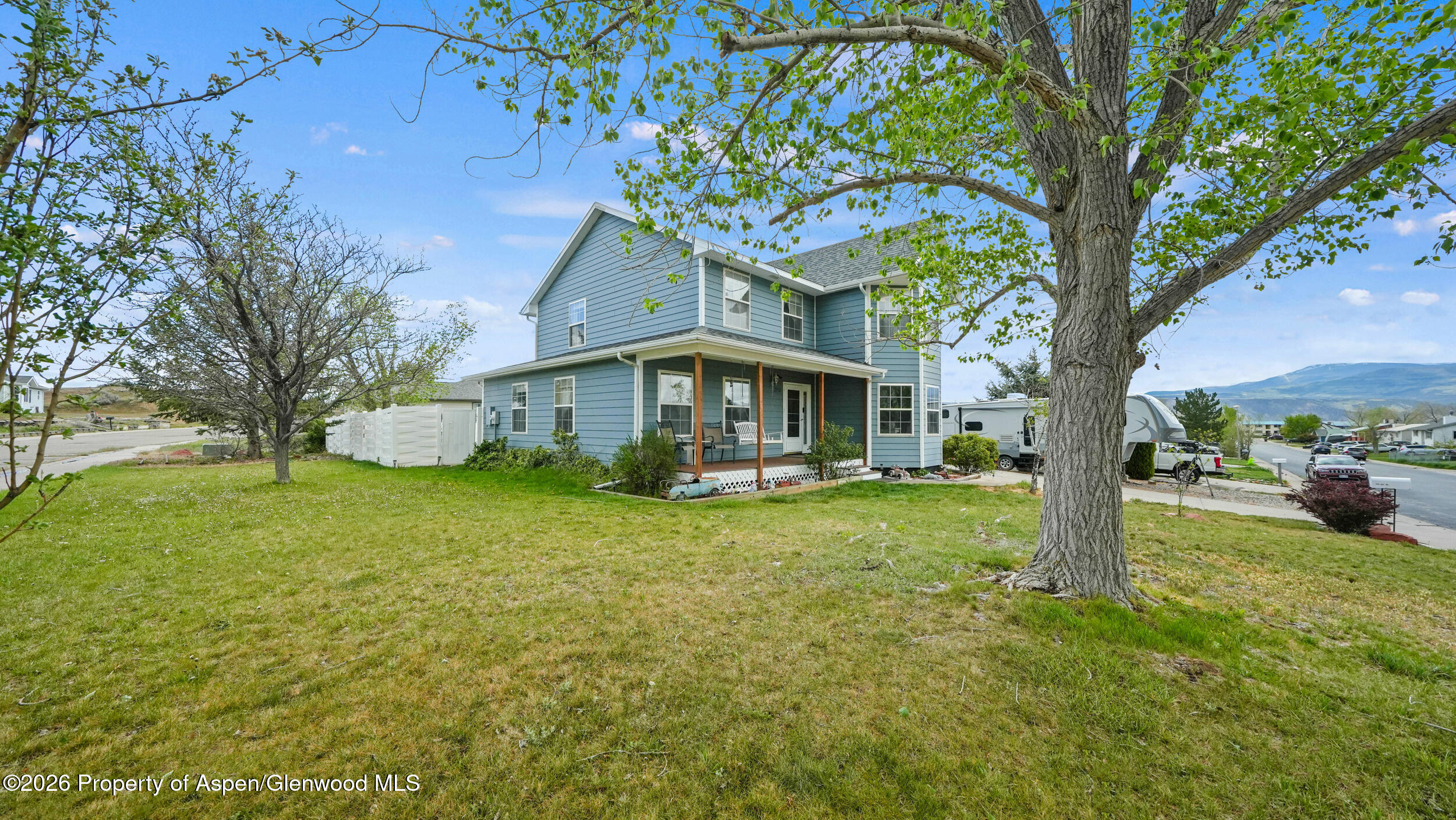 2750 East Avenue Rifle, CO 81650 - Photo 3 of 35 a front view of a house with garden