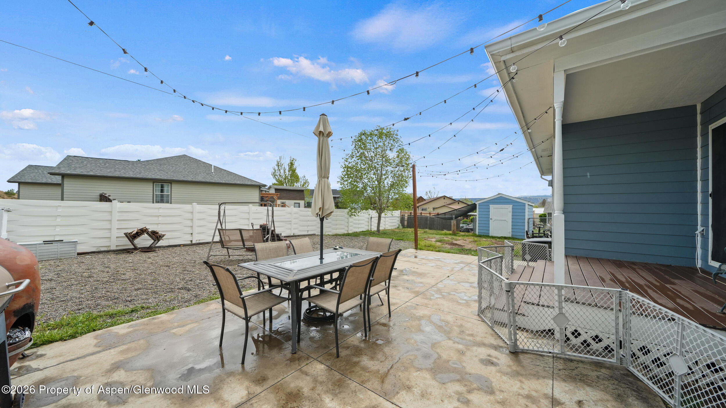 2750 East Avenue Rifle, CO 81650 - Photo 32 of 35 a view of a patio with a table and chairs under an umbrella
