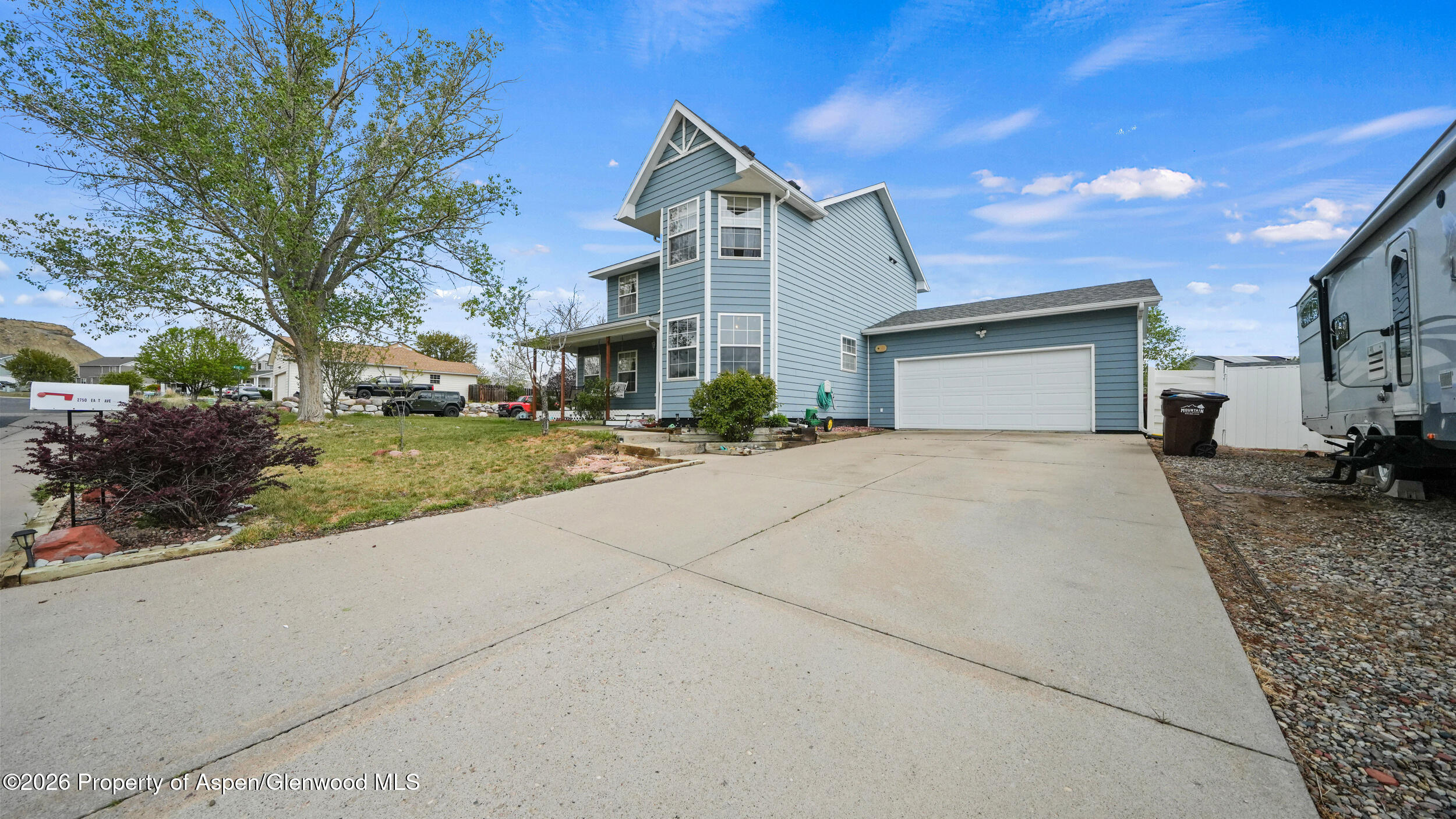 2750 East Avenue Rifle, CO 81650 - Photo 4 of 35 a front view of a house with a yard and garage