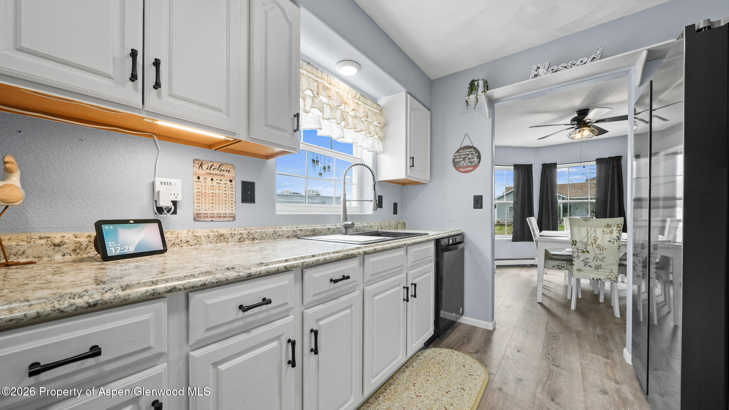 2750 East Avenue Rifle, CO 81650 - Photo 10 of 35 a kitchen with granite countertop lots of counter space and window