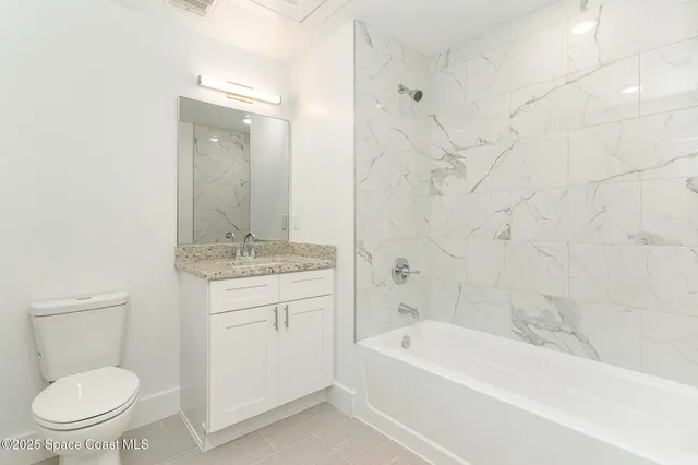 a bathroom with a sink a toilet and a bathtub