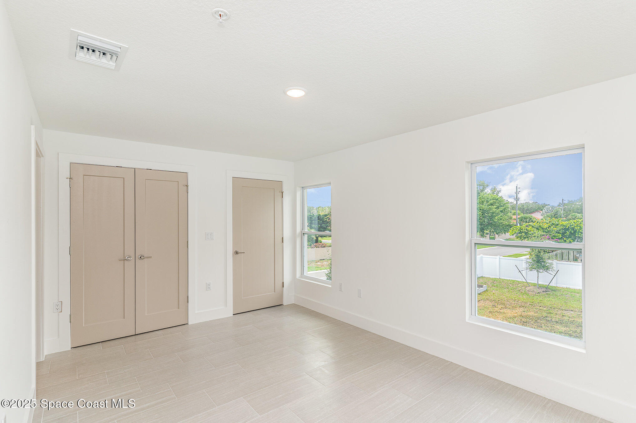 1625 Par Street, Unit 1206 Palm Bay, FL 32905 - Photo 19 of 38 an empty room with windows