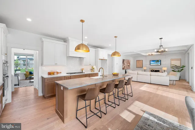 a view of a kitchen and kitchen island