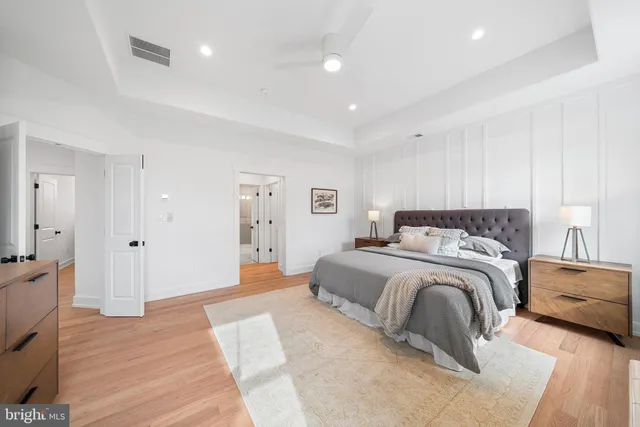 a spacious bedroom with a bed and a couch