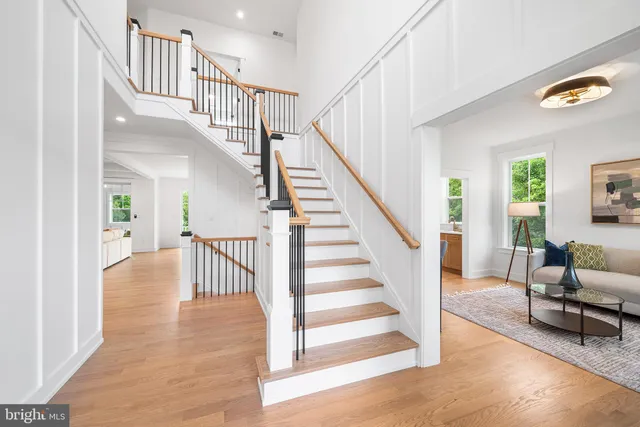 a view of entryway and hall with wooden floor