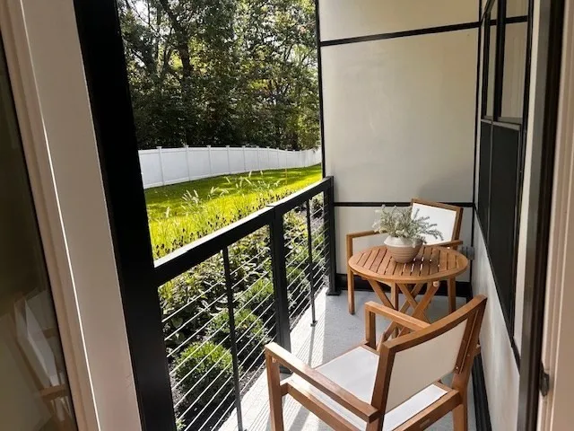 a view of balcony with furniture