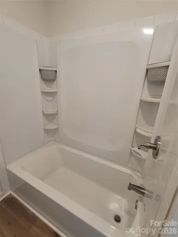 a close view of a bathtub in bathroom