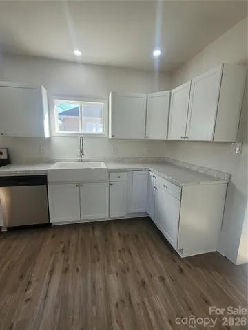 a view of cabinets and wooden floor