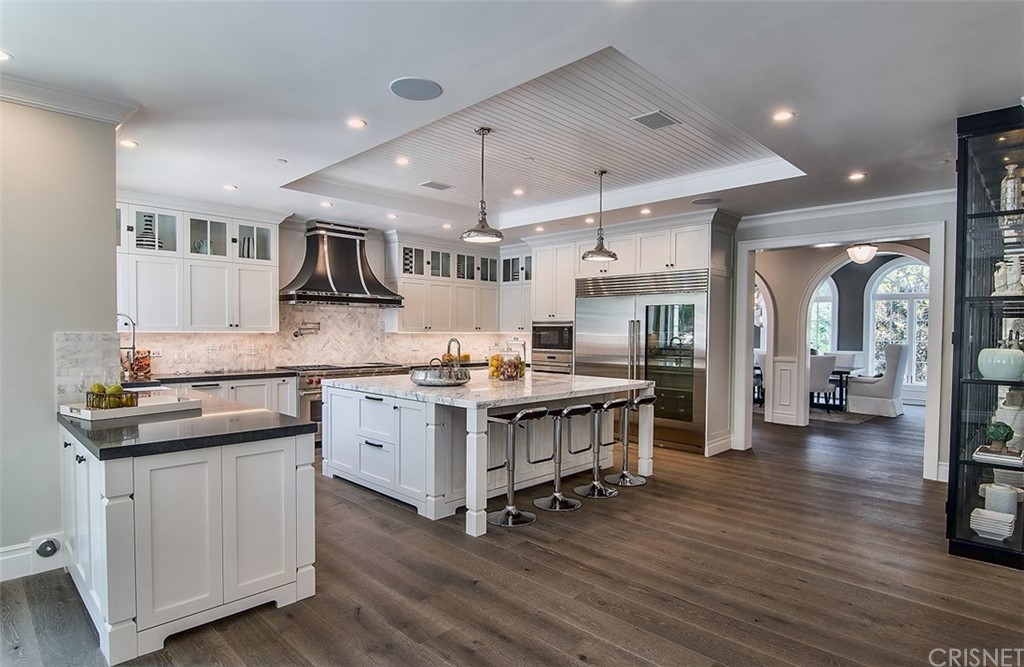 5546 Jed Smith Road Hidden Hills, CA 91302 - Photo 14 of 75 a kitchen with a sink stove and cabinets